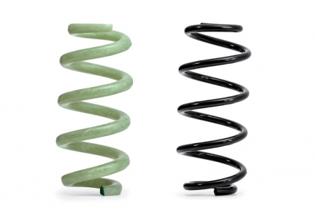 The GFRP spring (left) next to a 'traditional' steel type Whereas a steel spring for an executive class model weighs nearly 2.7 kilograms, a GFRP spring with the same properties weighs approximately 1.6 kilograms. Together, the four GFRP springs reduce the weight by roughly 4.4 kilograms, half of which pertains to the unsprung mass, helping the suspension to react more quickly to changes in the road surface and to absorb imperfections more effectively.The core of the springs consists of long glass fibres twisted together and impregnated with epoxy resin. A machine wraps additional fibres around this core - which is only a few millimetres in diameter - at alternating angles of plus and minus 45 degrees to the longitudinal axis. These tension and compression plies mutually support one another to optimally absorb the stresses acting on the component.The GFRP springs can be precisely tuned to their respective task, and the material exhibits outstanding properties. It does not corrode, even after stone chipping, and is impervious to chemicals such as wheel cleaners. Last but not least, production requires far less energy than the production of steel springs.